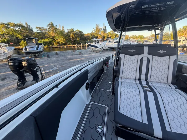  Yacht Photos Pics 2022 Fountain 38 SC boat interior with sleek seating and modern design.