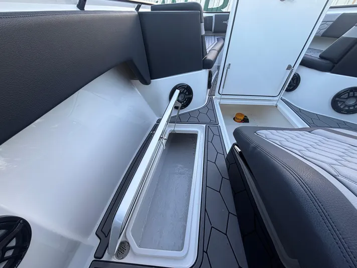  Yacht Photos Pics 2022 Fountain 38 SC boat interior with storage compartment and seating.