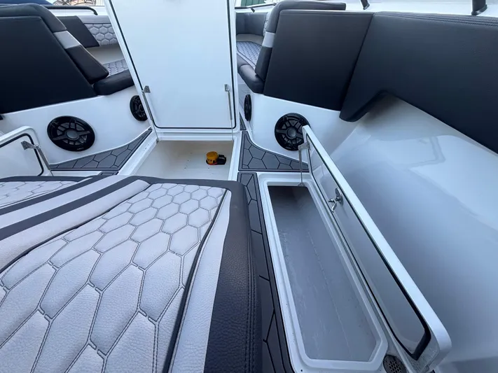  Yacht Photos Pics 2022 Fountain 38 SC boat interior with seating, storage, and speakers.