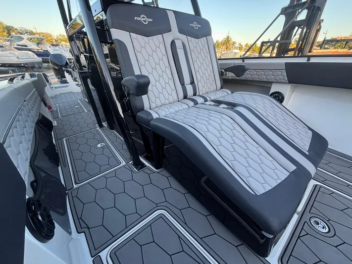  Yacht Photos Pics 2022 Fountain 38 SC boat interior with hexagonal pattern seating and flooring.