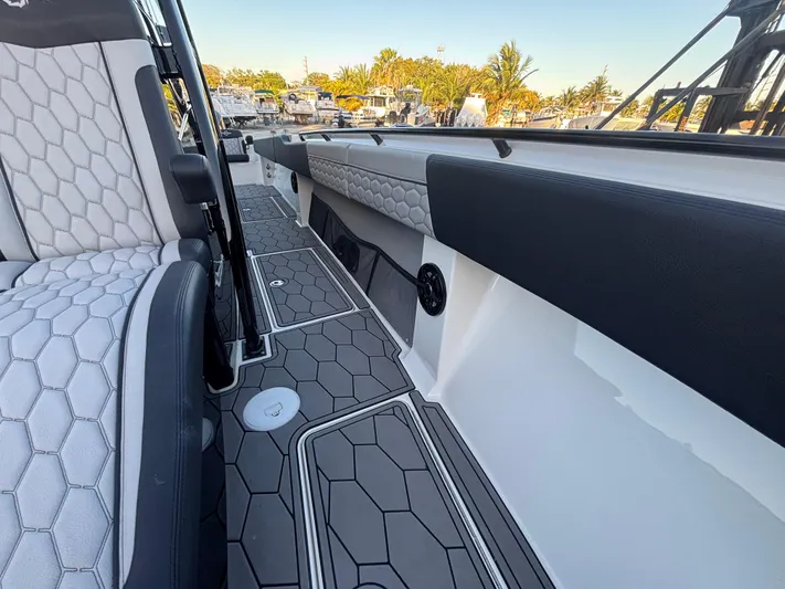  Yacht Photos Pics 2022 Fountain 38 SC boat interior with hexagonal pattern seats and flooring.