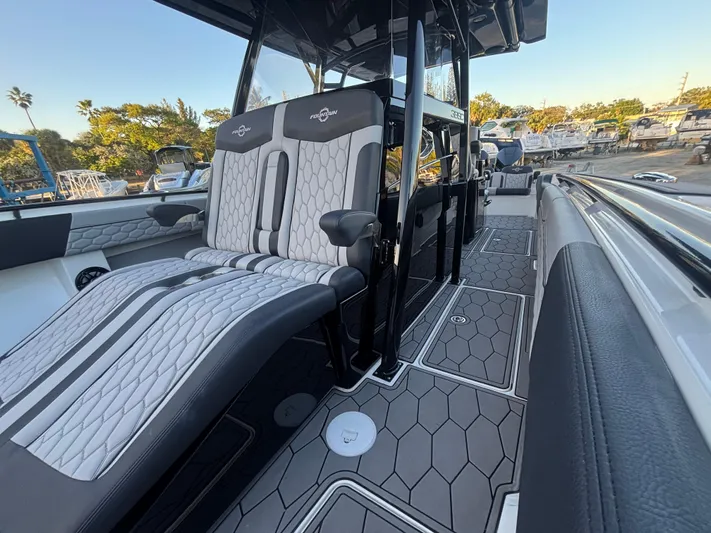  Yacht Photos Pics 2022 Fountain 38 SC boat interior with sleek seating and modern design.