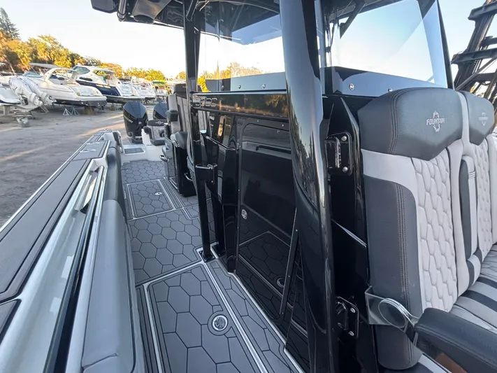  Yacht Photos Pics 2022 Fountain 38 SC boat interior with sleek seating and modern design.
