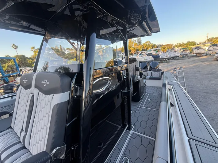  Yacht Photos Pics 2022 Fountain 38 SC boat interior with sleek seating and modern design.
