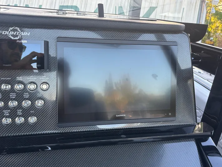  Yacht Photos Pics 2022 Fountain 38 SC dashboard with Garmin display and control panel.