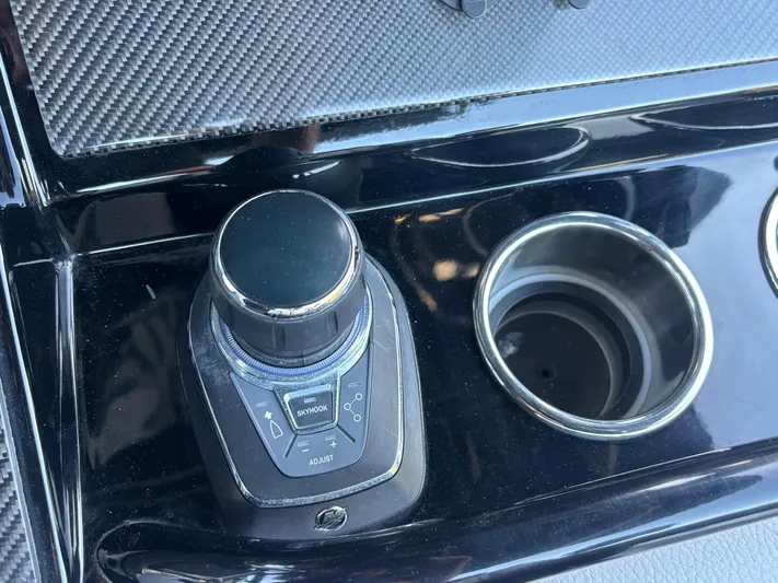  Yacht Photos Pics Control panel of 2022 Fountain 38 SC boat with joystick and cup holder.