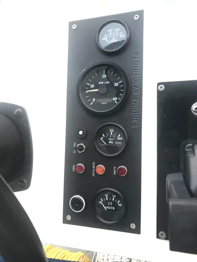 Morning Star V Yacht Photos Pics Instrument panel of a 1997 Albin 31 Tournament boat with gauges and controls.