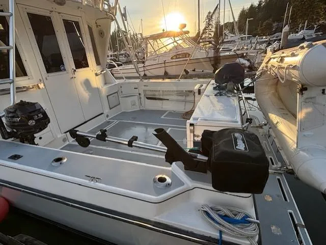 Morning Star V Yacht Photos Pics 1997 Albin 31 Tournament boat at sunset in marina, featuring spacious deck and fishing equipment.