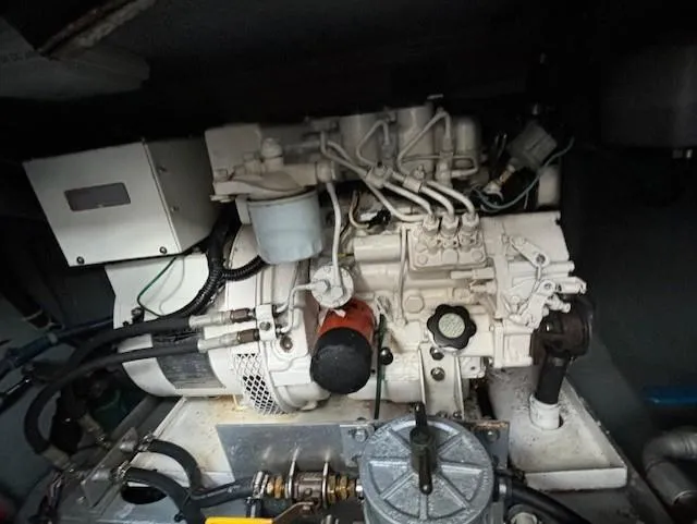 Morning Star V Yacht Photos Pics Engine compartment of a 1997 Albin 31 Tournament boat, showcasing mechanical components.