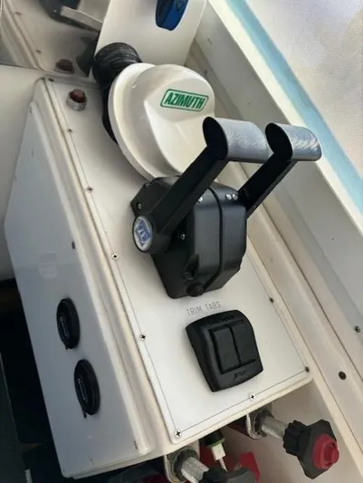 Morning Star V Yacht Photos Pics Control panel of a 1997 Albin 31 Tournament boat with throttle levers and Azimuth compass.