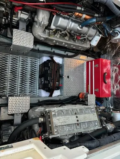 Morning Star V Yacht Photos Pics Engine compartment of a 1997 Albin 31 Tournament boat with visible components and red toolbox.
