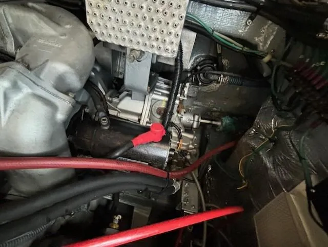 Morning Star V Yacht Photos Pics Engine compartment of a 1997 Albin 31 Tournament boat, featuring cables and mechanical components.