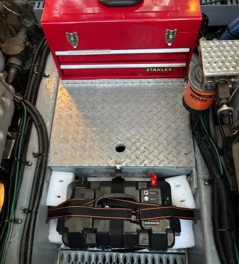 Morning Star V Yacht Photos Pics Engine compartment of a 1997 Albin 31 Tournament with a red Stanley toolbox and battery.