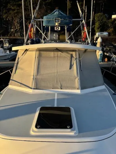 Morning Star V Yacht Photos Pics 1997 Albin 31 Tournament boat with covered cockpit, docked in a marina.
