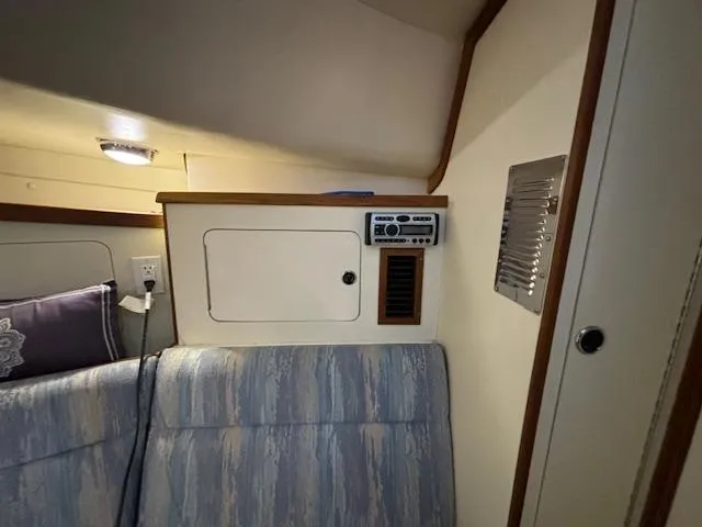 Morning Star V Yacht Photos Pics Interior cabin of a 1997 Albin 31 Tournament boat with seating and control panel.