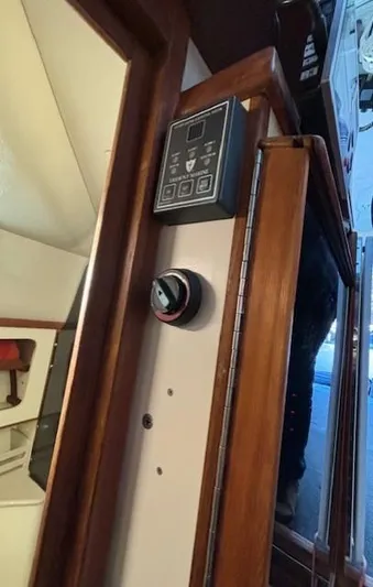 Morning Star V Yacht Photos Pics 1997 Albin 31 Tournament boat interior with control panel and wooden trim.