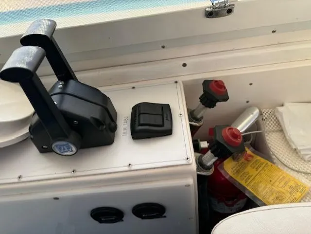 Morning Star V Yacht Photos Pics Control panel of a 1997 Albin 31 Tournament boat with throttle and fire extinguisher.
