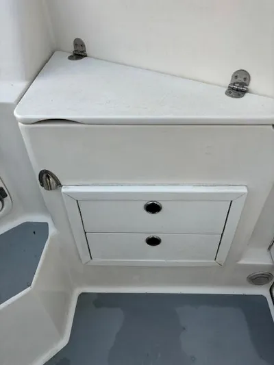 Morning Star V Yacht Photos Pics 1997 Albin 31 Tournament boat interior storage compartment with two drawers.
