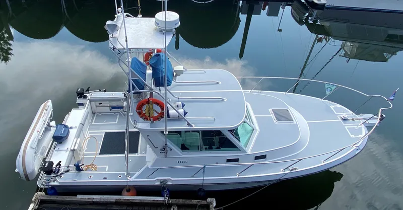 Morning Star V Yacht Photos Pics 1997 Albin 31 Tournament boat docked, featuring a sleek design and fishing equipment.