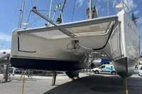 2018 Leopard 45 catamaran on dry dock, showcasing hull and rigging details.