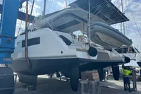 2018 Leopard 45 catamaran in dry dock with solar panels and dinghy.