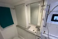 Modern bathroom in 2018 Leopard 45 yacht with sleek fixtures and teal towel.