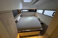 Luxurious cabin interior of 2018 Leopard 45 yacht with modern design and ample natural light.