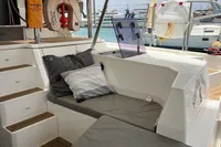 2018 Leopard 45 yacht interior with cushioned seating, pillows, and nautical equipment.