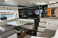 Spacious interior of 2018 Leopard 45 catamaran with seating and dining area.