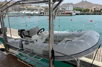 Inflatable dinghy on Leopard 45 yacht, docked in a scenic marina, 2018 model.