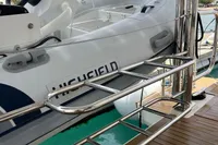 Highfield inflatable boat on Leopard 45 yacht, 2018 model, docked at marina.