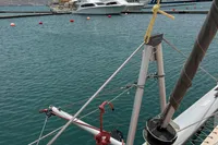 Sailboat rigging on a 2018 Leopard 45 catamaran docked in a marina.