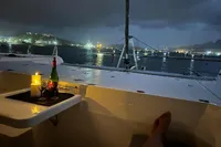Luxury evening on a 2018 Leopard 45 yacht with wine and candlelight.