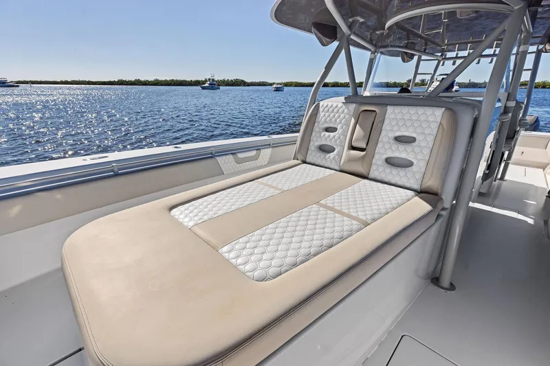  Yacht Photos Pics 2022 Contender 44 CB boat with luxurious seating on a sunny day.