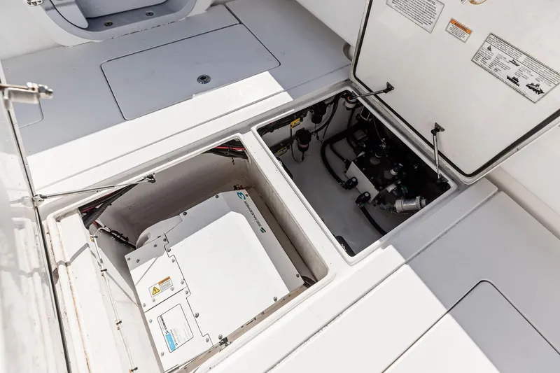  Yacht Photos Pics 2022 Contender 44 CB boat engine compartment with open hatches and visible equipment.