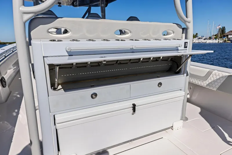  Yacht Photos Pics 2022 Contender 44 CB boat with open storage compartments and rod holders.