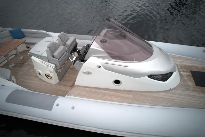  Yacht Photos Pics 2014 SACS Strider 13 boat with modern seating and control console.