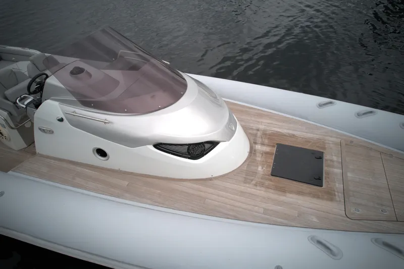  Yacht Photos Pics 2014 SACS Strider 13 boat with sleek design on water.