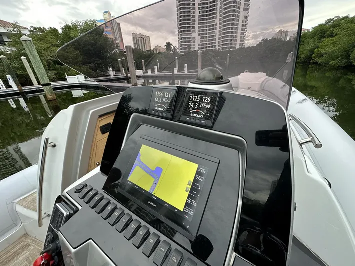  Yacht Photos Pics Control panel of a 2014 SACS Strider 13 boat with navigation display.