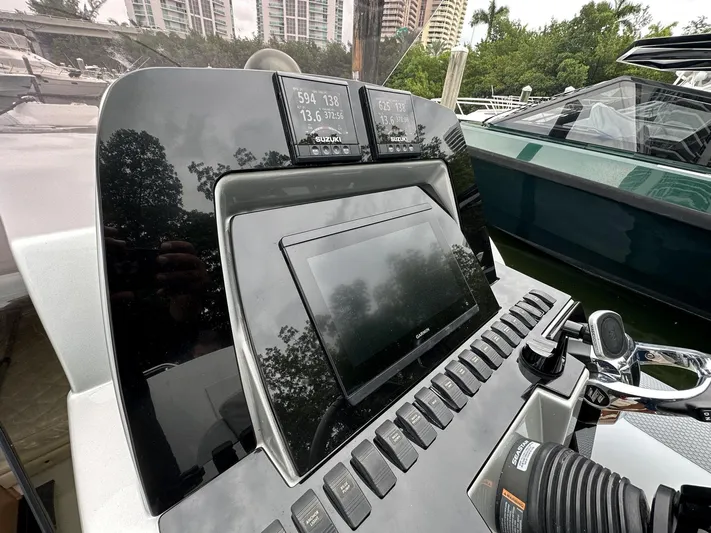  Yacht Photos Pics 2014 SACS Strider 13 dashboard with navigation and control systems.