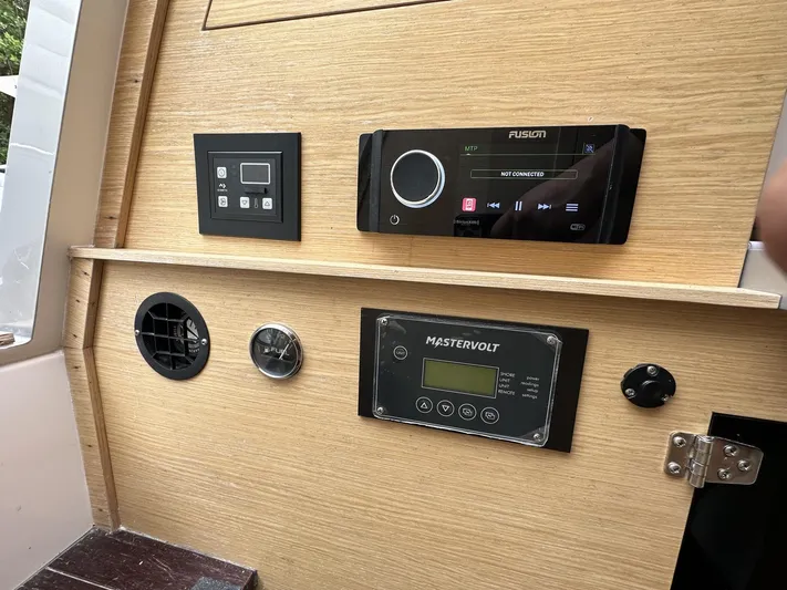  Yacht Photos Pics Control panel of a 2014 SACS Strider 13 boat with Fusion and Mastervolt systems.