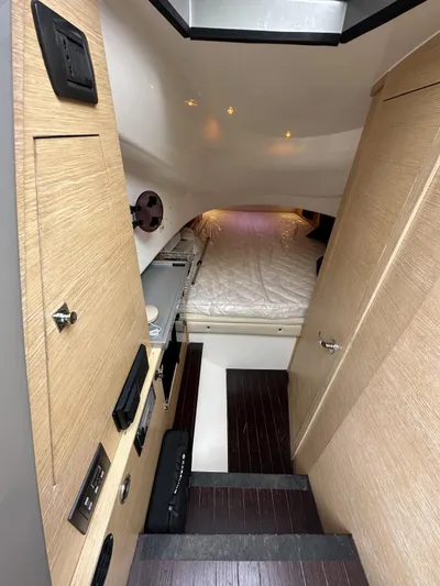  Yacht Photos Pics Interior cabin of a 2014 SACS Strider 13 boat with modern amenities.