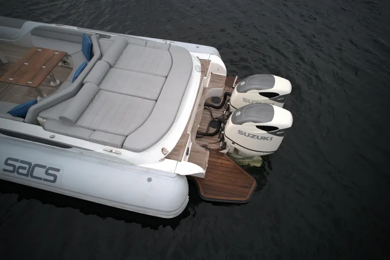  Yacht Photos Pics 2014 SACS Strider 13 boat with Suzuki outboard engines on water.