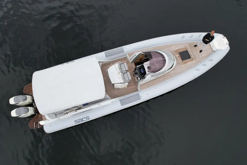  Yacht Photos Pics Aerial view of a 2014 SACS Strider 13 boat on water.