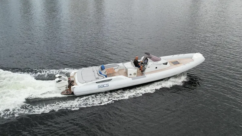  Yacht Photos Pics 2014 SACS Strider 13 luxury boat cruising on water.