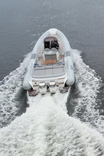  Yacht Photos Pics 2014 SACS Strider 13 inflatable boat cruising on water.