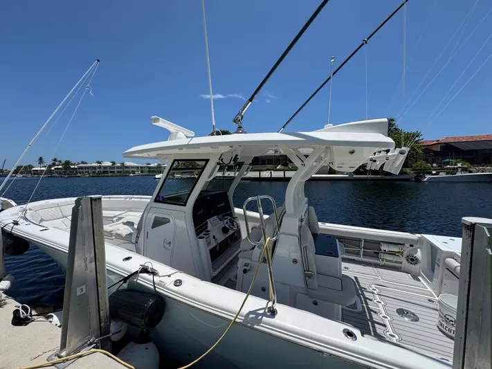  Yacht Photos Pics 2023 Sea Fox 368 Commander boat docked, showcasing sleek design and modern features.