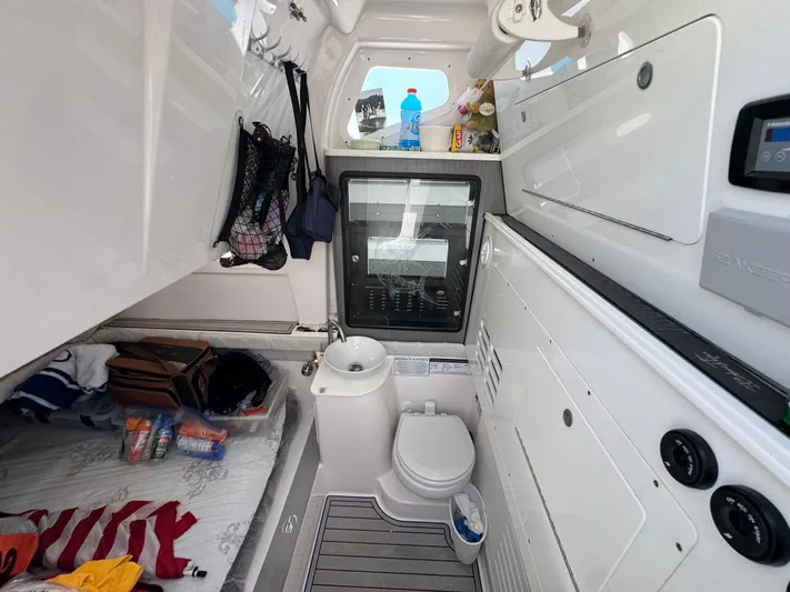  Yacht Photos Pics 2023 Sea Fox 368 Commander cabin interior with bed, sink, and storage.