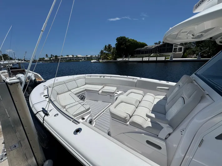  Yacht Photos Pics 2023 Sea Fox 368 Commander boat docked, featuring luxurious seating and sleek design.