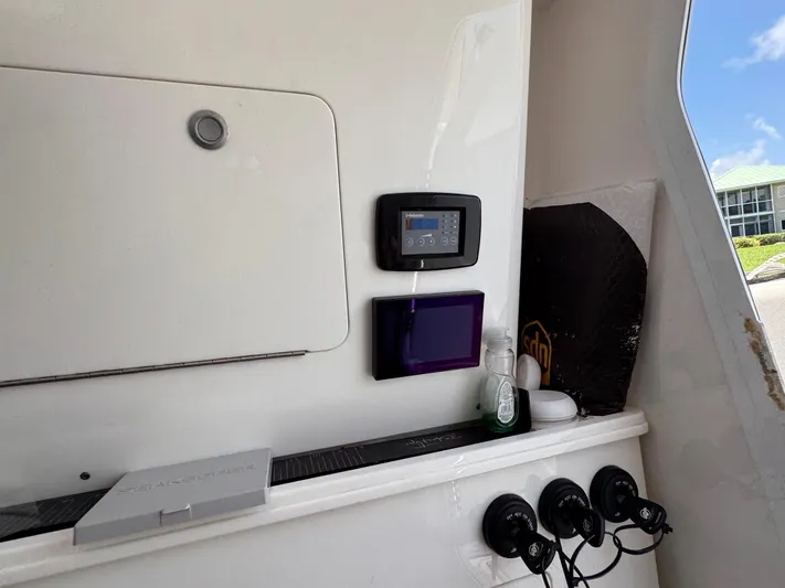  Yacht Photos Pics Interior view of 2023 Sea Fox 368 Commander boat with control panel and storage area.